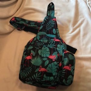 Lug, flamingo print cross body backpack.